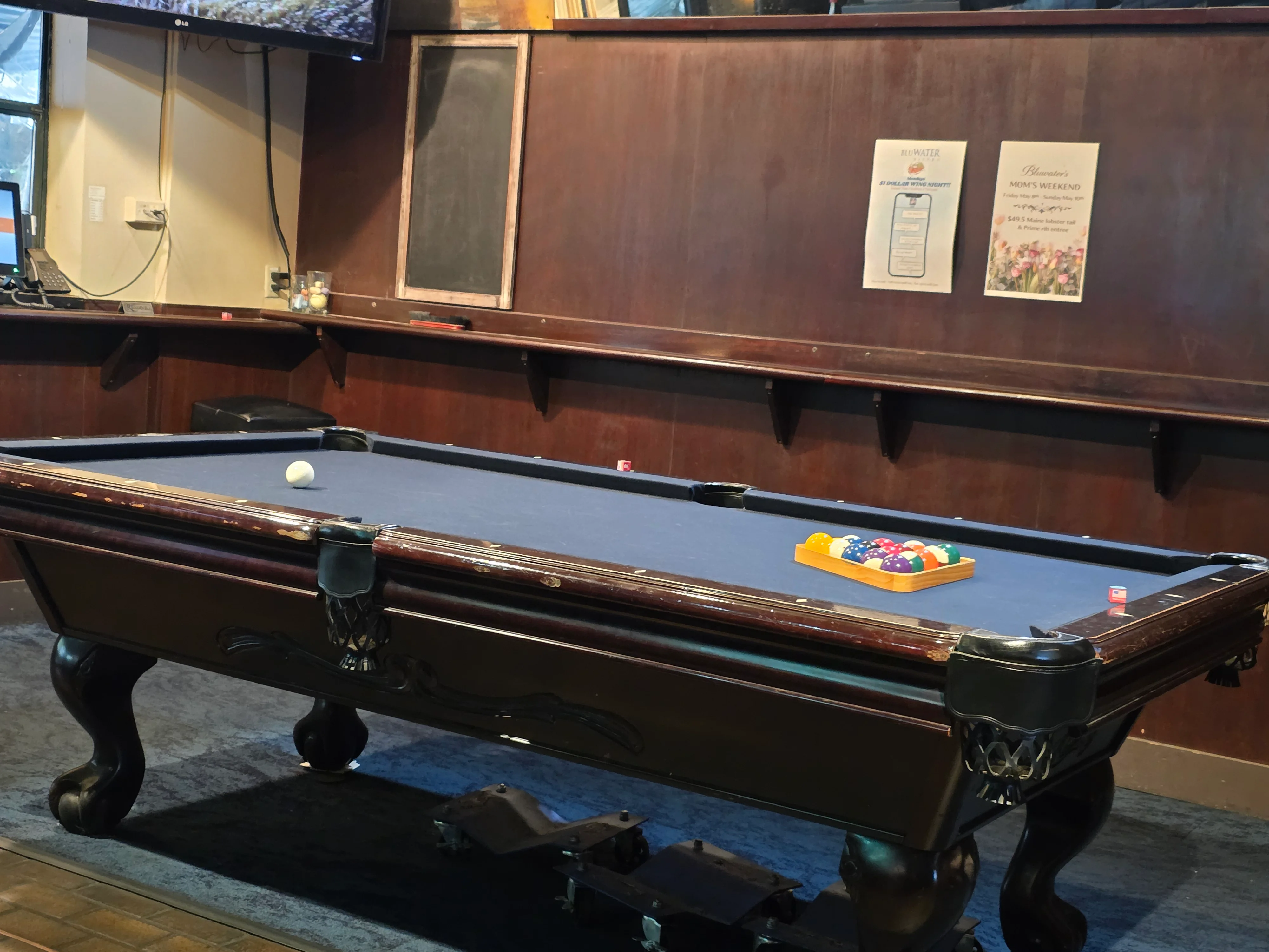 Evening bar atmosphere around the pool table at BluWater Bistro Leschi