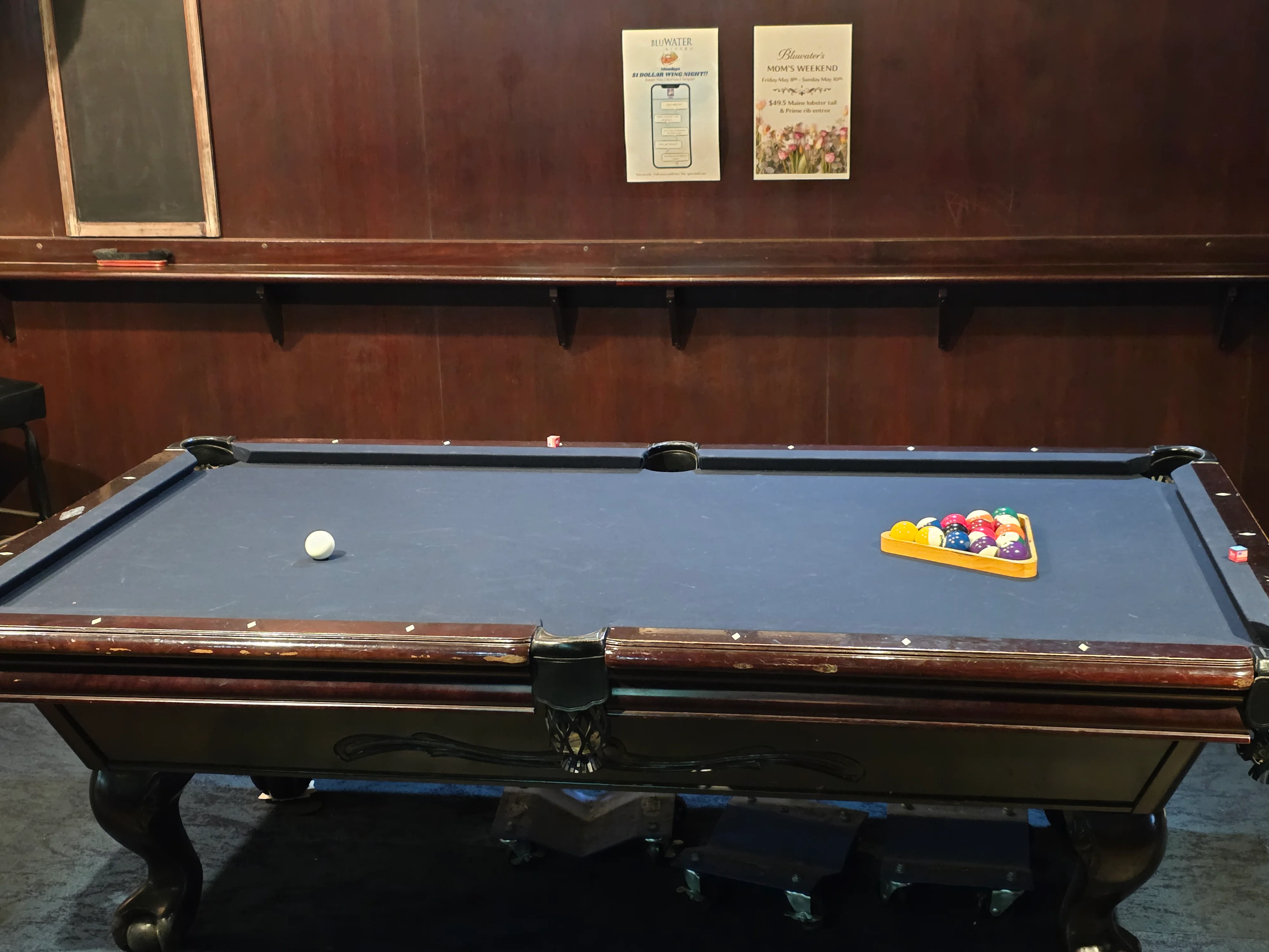Weekend crowd and game rotation at the BluWater Bistro pool table