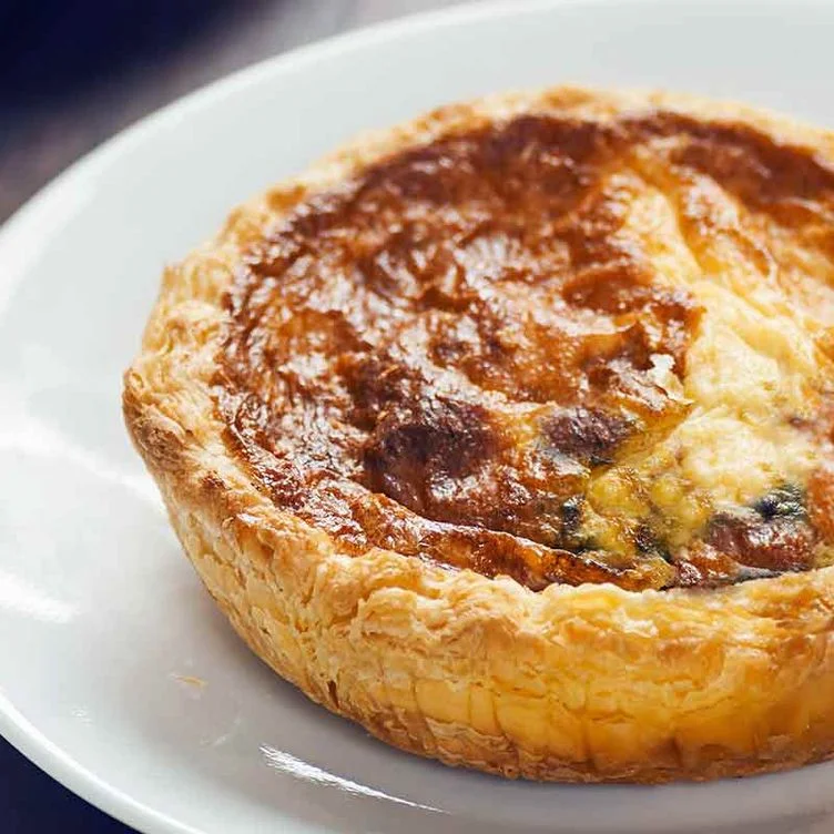 Dungeness Crab Quiche with breakfast potatoes and fruit